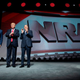 President Donald Trump (center) stands with National Rifle Association President Wayne LaPierre (right) and NRA-ILos Angeles Executive Director Chris Cox during the NRA Leadership Forum in Atlanta April 28, 2017. (Jim Watson/AFP/Getty Images)
